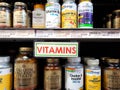 Vitamins sign and products line store shelves