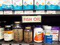 Fish Oil sign and products line store shelves