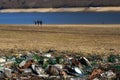 Plastic glass metal and paper waste on the lakeside