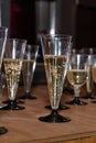 plastic Glasses of champagne on table bar. Buffet. Celebration of birthday, baptism, wedding or corporate party Royalty Free Stock Photo