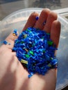 Plastic granulate polypropylene close up in hand multiple colors Royalty Free Stock Photo