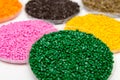 The plastic granules. Dye for polypropylene, polystyrene granules into a measuring container Royalty Free Stock Photo