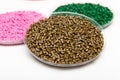 The plastic granules. Dye for polypropylene, polystyrene granules into a measuring container Royalty Free Stock Photo