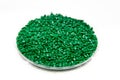 The plastic granules. Dye for polypropylene, polystyrene granules into a measuring container. Royalty Free Stock Photo