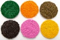 The plastic granules. Dye for polypropylene, polystyrene granules into a measuring container Royalty Free Stock Photo