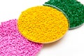 The plastic granules. Dye for polypropylene, polystyrene granules into a measuring container. Royalty Free Stock Photo