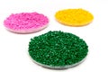 The plastic granules. Dye for polypropylene, polystyrene granules into a measuring container Royalty Free Stock Photo
