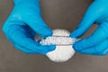 Plastic granules . Polyethylene pellets and hands with gloves. Quality control of plastic in the laboratory in production. BPA