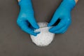 Plastic granules . Polyethylene pellets and hands with gloves. Quality control of plastic in the laboratory in production. BPA