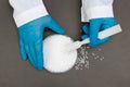 Plastic granules . Polypropylene, polyethylene pellets in hands with gloves. Quality control of plastic in the laboratory in