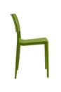 Plastic green chair with a wicker back. Patio or cafe furniture. Royalty Free Stock Photo