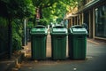 Plastic green trash cans on street. Waste containers for garbage separation Royalty Free Stock Photo