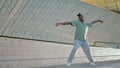 Plastic guy dancing contemporary street alone. Talented man showing choreography