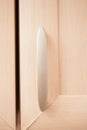 Plastic handle on wooden Cabinet door Royalty Free Stock Photo