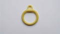 Plastic hook ring accessory simple and smooth, small and circular, flat on white Royalty Free Stock Photo