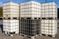 Plastic IBC tank, container with metal pallet for storing and transporting liquid Royalty Free Stock Photo