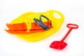 Plastic ice-boat, shovel and skis Royalty Free Stock Photo