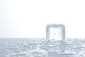 plastic ice cube with water and blue tint Royalty Free Stock Photo
