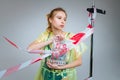 Blonde model holding bag with plastic items while posing Royalty Free Stock Photo