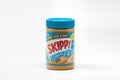 Plastic jar of skippy peanut butter spread