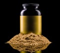Plastic jar of sport nutrition like whey protein casein, bcaa on heap of powder Royalty Free Stock Photo