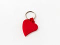 Plastic key ring breloque in the shape of a red heart on a white background Royalty Free Stock Photo