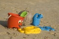 Plastic kids toys on the sand beach Royalty Free Stock Photo