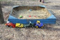 Plastic kids toys and a sandpit Royalty Free Stock Photo