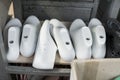 Plastic lasts used in the manufacture of shoes. Row of plastic shoe lasts used to manufacture modern day shoes. A lot of