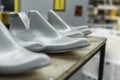 Plastic lasts used in the manufacture of shoes. Row of plastic shoe lasts used to manufacture modern day shoes. A lot of