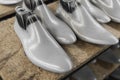 Plastic lasts used in the manufacture of shoes. Row of plastic shoe lasts used to manufacture modern day shoes. A lot of