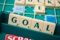 Plastic letters forming the word goal on Scrabble board game Royalty Free Stock Photo