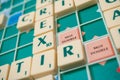 Plastic letters on Scrabble board game forming the word : Brexit