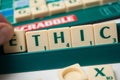 Plastic letters on Scrabble board game forming the word : Ethic Royalty Free Stock Photo