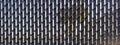 a plastic linked mesh fence chain slats rows woven row fencing yard backyard wire barrier link security privacy parallel rural Royalty Free Stock Photo