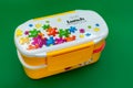 Plastic lunch box with colorful puzzle pieces Royalty Free Stock Photo