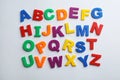 Plastic magnetic letters isolated on white, top view.