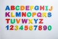 Plastic magnetic letters and numbers isolated on white Royalty Free Stock Photo