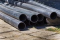 Plastic main pipes. A heap of polyethylene pipes for a water supply system. Royalty Free Stock Photo