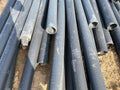 Plastic main pipes. A heap of polyethylene pipes for a water supply system. Objects for laying of city communications and the Royalty Free Stock Photo