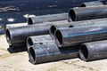 Plastic main pipes. A heap of polyethylene pipes for a water supply system. Royalty Free Stock Photo