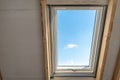 Plastic mansard window with triple glasses and clear view on sky Royalty Free Stock Photo