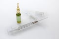 Plastic medical syringe with hypodermic needle and ampules of me Royalty Free Stock Photo