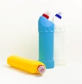 Plastic multi-colored bottles for liquid detergent, cleaning agent, bleach, antibacterial gel on light background. House cleaning Royalty Free Stock Photo