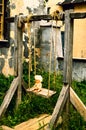 Plastic naked doll on a wooden swing. Royalty Free Stock Photo