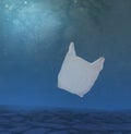 Plastic ocean pollution, white bag underwater. Royalty Free Stock Photo