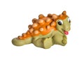 Plastic orange dinosaur toy, Ankylosaurus.