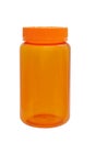 Plastic orange small bottle for pills and tablets, empty with a cover isolated on a white background Royalty Free Stock Photo