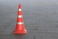 Plastic orange traffic cone on city street Royalty Free Stock Photo