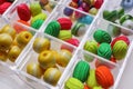 Plastic organizer with different beads on white background, closeup Royalty Free Stock Photo